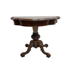 Victorian rosewood serpentine tea table, shaped fold-over and swivel top, raised on egg and dart carved baluster pedestal terminating in four scroll carved cabriole splay supports