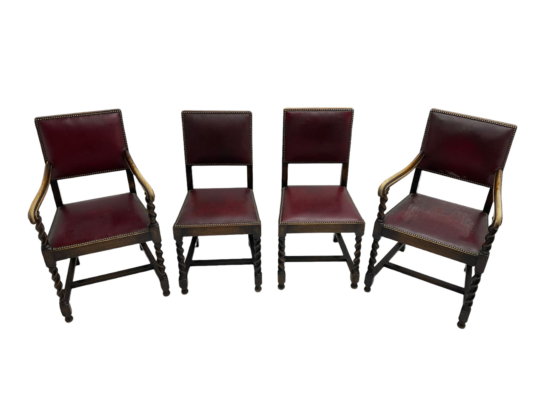 Set four early 20th century oak barley twist dining chairs, upholstered in burgundy leather with stud work, two carvers and two side chairs