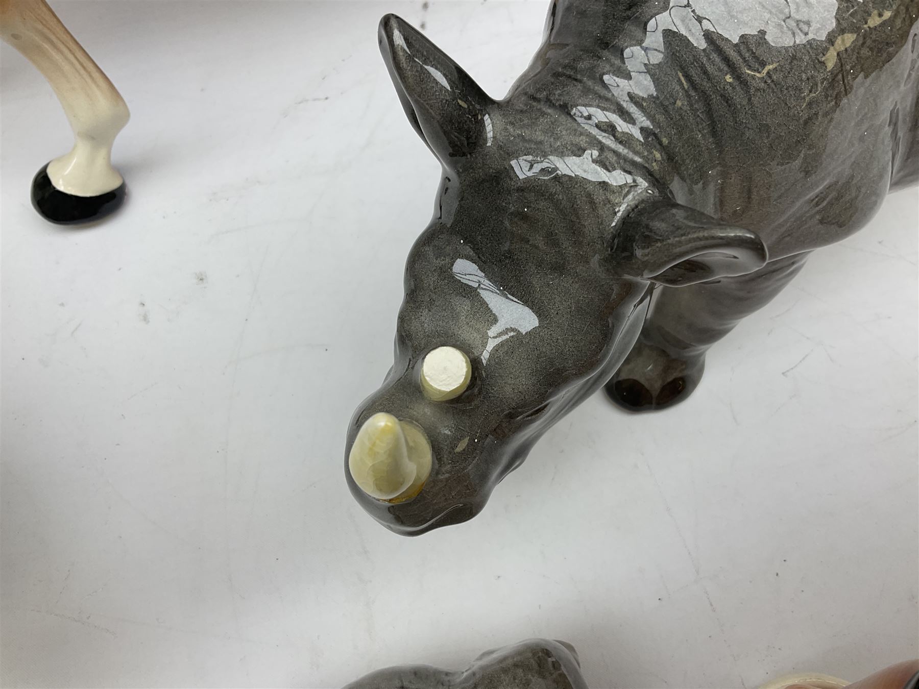 Beswick model of a seated bulldog, model no. 1872, Beswick Laurel & Hardy cruet set on stand, no. 575, Melba Ware animal figures to include large horse, hippo, rhino, USSR tiger cub figure, other ceramics to include Mason's lidded jar etc