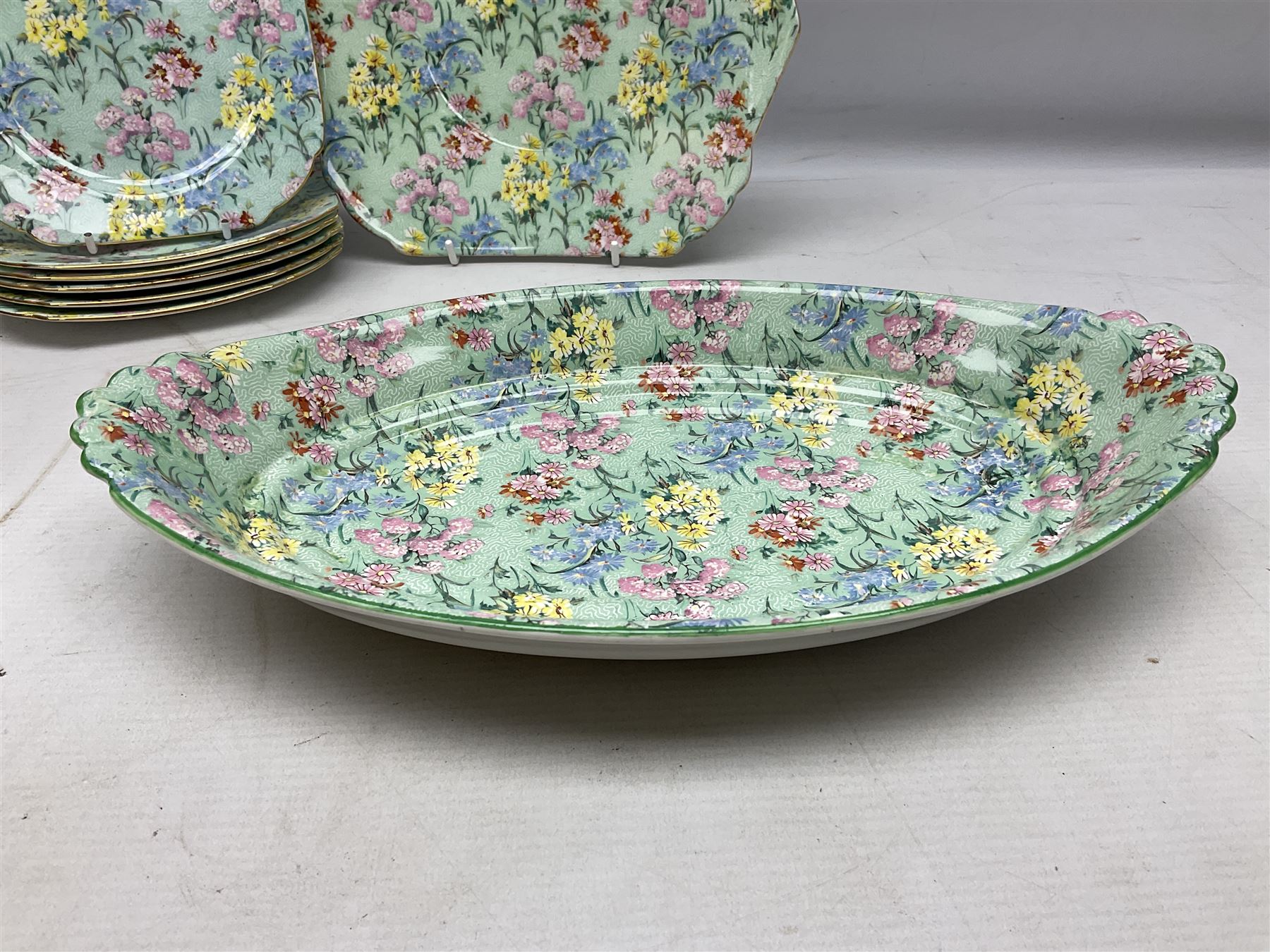 Shelley Melody pattern tea service for six, to include teapot, teapot stand, hot water jug, milk jug, covered sucrier, teacups and saucers, cake plates etc (31)