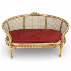 19th century giltwood and gesso settee, with shaped crest rail centred by carved floral de...