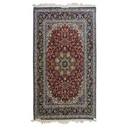 Fine Central Persian Isfahan hand-knotted rug, madder red field with central finely drawn ...