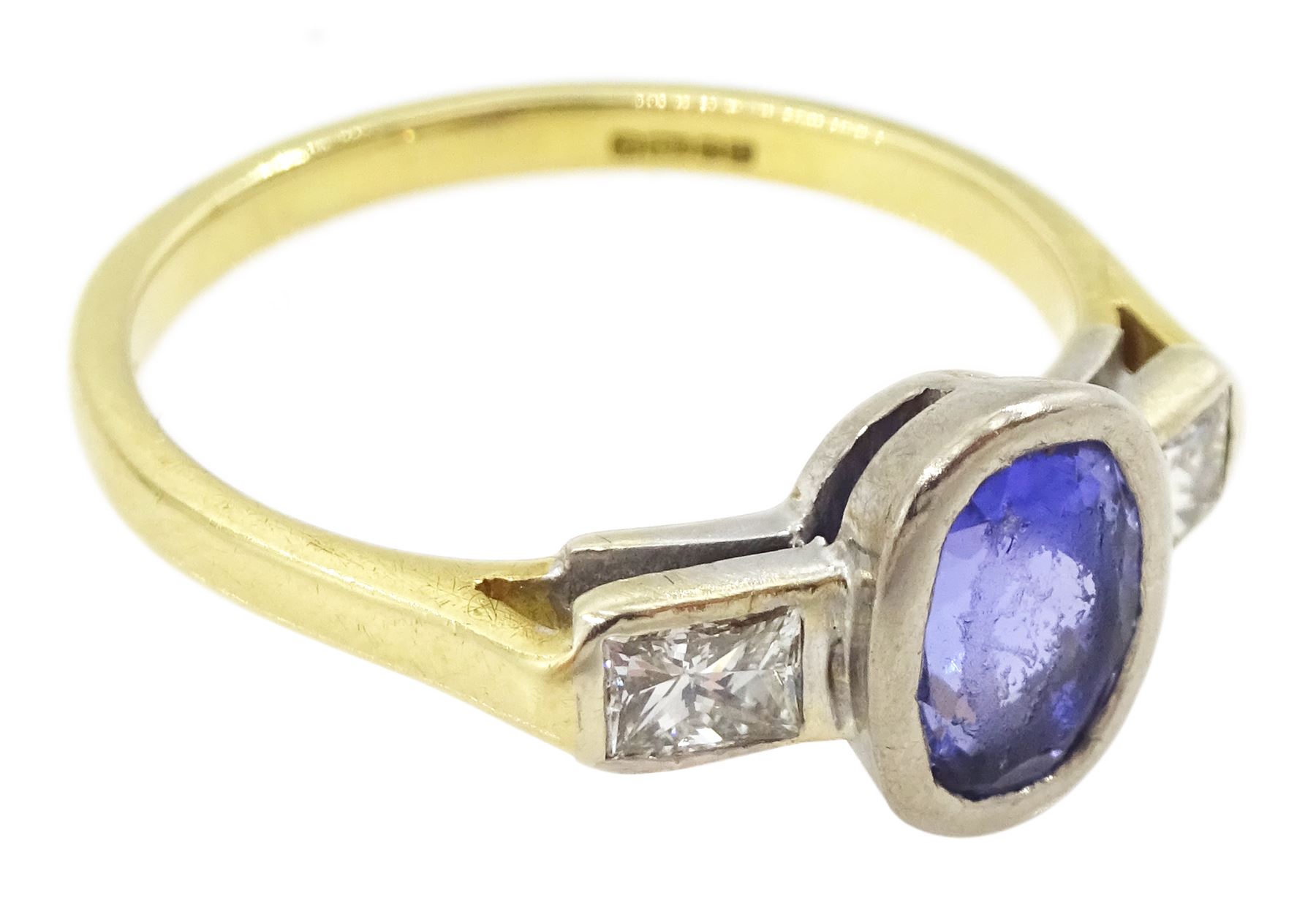 18ct gold three stone oval cut tanzanite and radiant cut diamond ring, hallmarked, tanzanite approx 1.10 carat, total diamond weight approx 0.40 carat