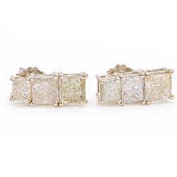 Pair of 18ct white gold diamond earrings, each stud set with three graduating princess cut diamonds, stamped 750, total diamond weight approx 1.70 carat