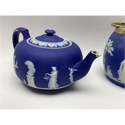 Three pieces of Victorian Wedgwood Jasperware, comprising biscuit barrel with silver plated lid and handle, H17cm, further barrel with silver plated lid and handle, H11cm, and teapot, H13cm, each with impressed marks beneath. 