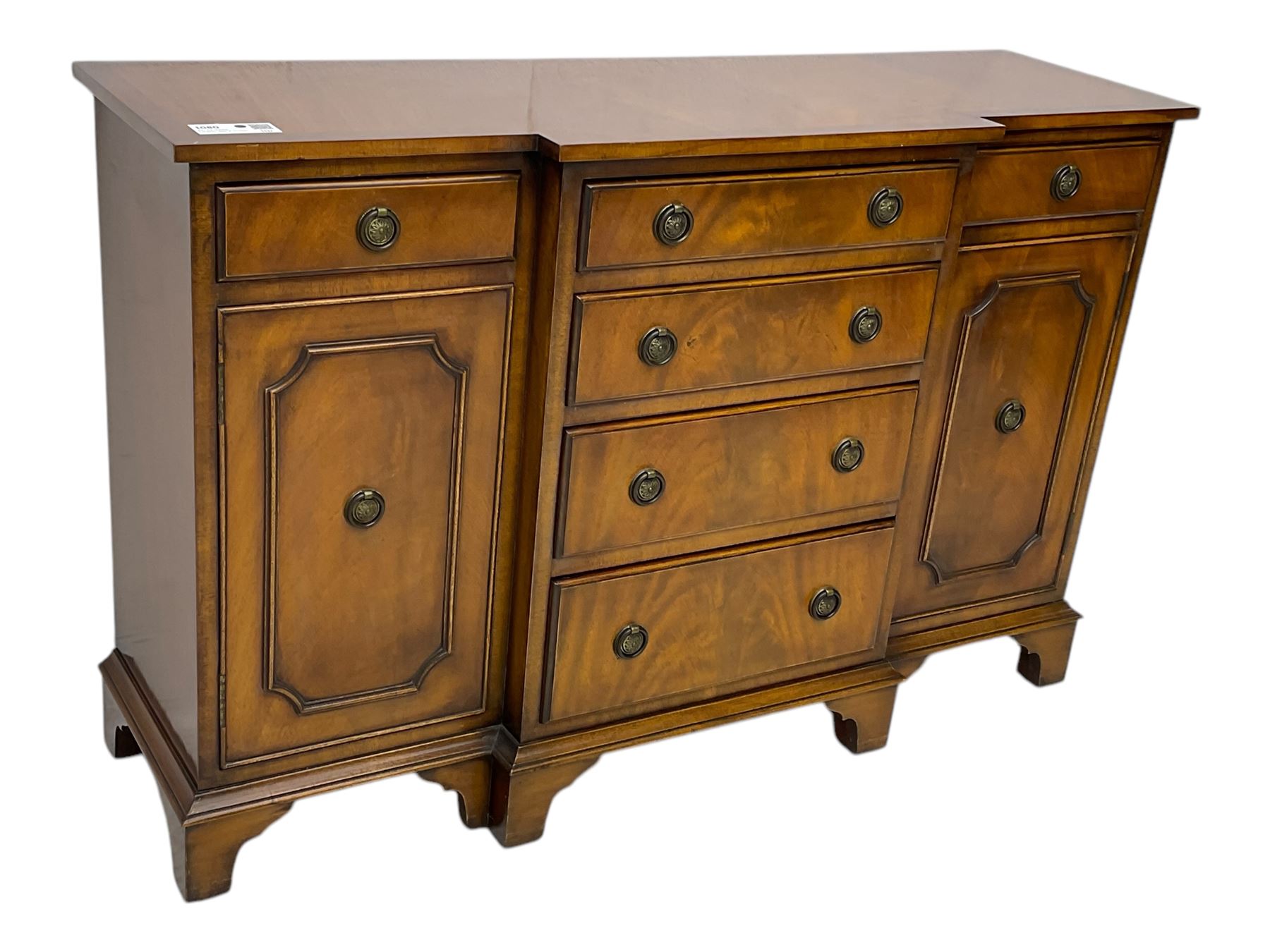 Georgian design mahogany break-front sideboard, fitted with six drawers and two cupboards, on bracket feet 