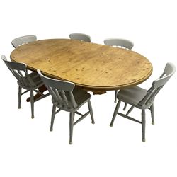 20th century pine extending dining table, oval top over twin bulbous turned pedestal base united by stretcher, with additional leaf (W160cm D120cm H79cm); and set of seven ash painted dining chairs, spindle back, raised on ring turned supports joined by H-stretcher