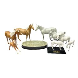 Collection of Beswick horses, including grey horse no.701, palomino foal no 836, grey stocky jogging mare no.855 etc, together two Royal Doulton horses, (8)