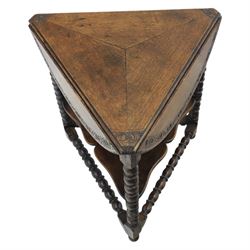 19th century country oak circular occasional table, featuring three triangular drop leaves, above shaped middle tier shelf, raised on bobbin turned legs and joining stretchers