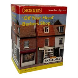 Ten Hornby '00' gauge Skaledale buildings, comprising two R8744 Straight Walls, R8564 Model Shop, R9768 The Pharmacy, R8501 Raven Cottage, R8515 Clovelly Cottage, R8626 Country Fire Station, R8588 Weighbridge & Scales, R8638 Platform & Shelter and R9763 Off Your Head Barbers Shop, all boxed