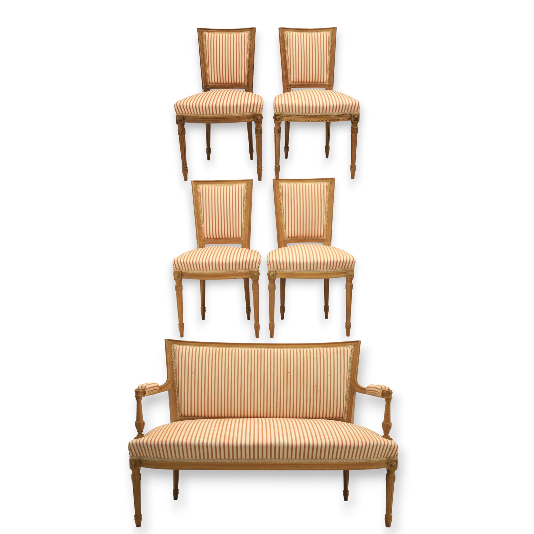 20th century Louis XVI style beech salon suite, comprising settee and four chairs, the settee with shaped rectangular back and upholstered arms over a shaped seat, the chairs with rectangular backs and overstuffed seats, each upholstered in striped fabric with close-nailed borders, upon fluted tapering supports headed by carved paterae, terminating in toupie feet, chairs H89cm W47cm