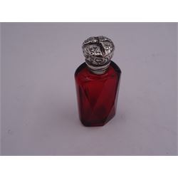 Victorian silver mounted scent bottle, the faceted ruby glass body with silver mounted foliate embossed hinged cover, opening to reveal a internal stopper, unmarked, H6cm 