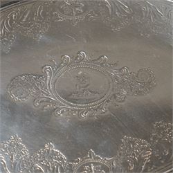 George III Irish silver oval teapot stand engraved with garlands scrolls and central crest on shaped supports L20cm Dublin 1802 Maker possibly Richard Sawyer