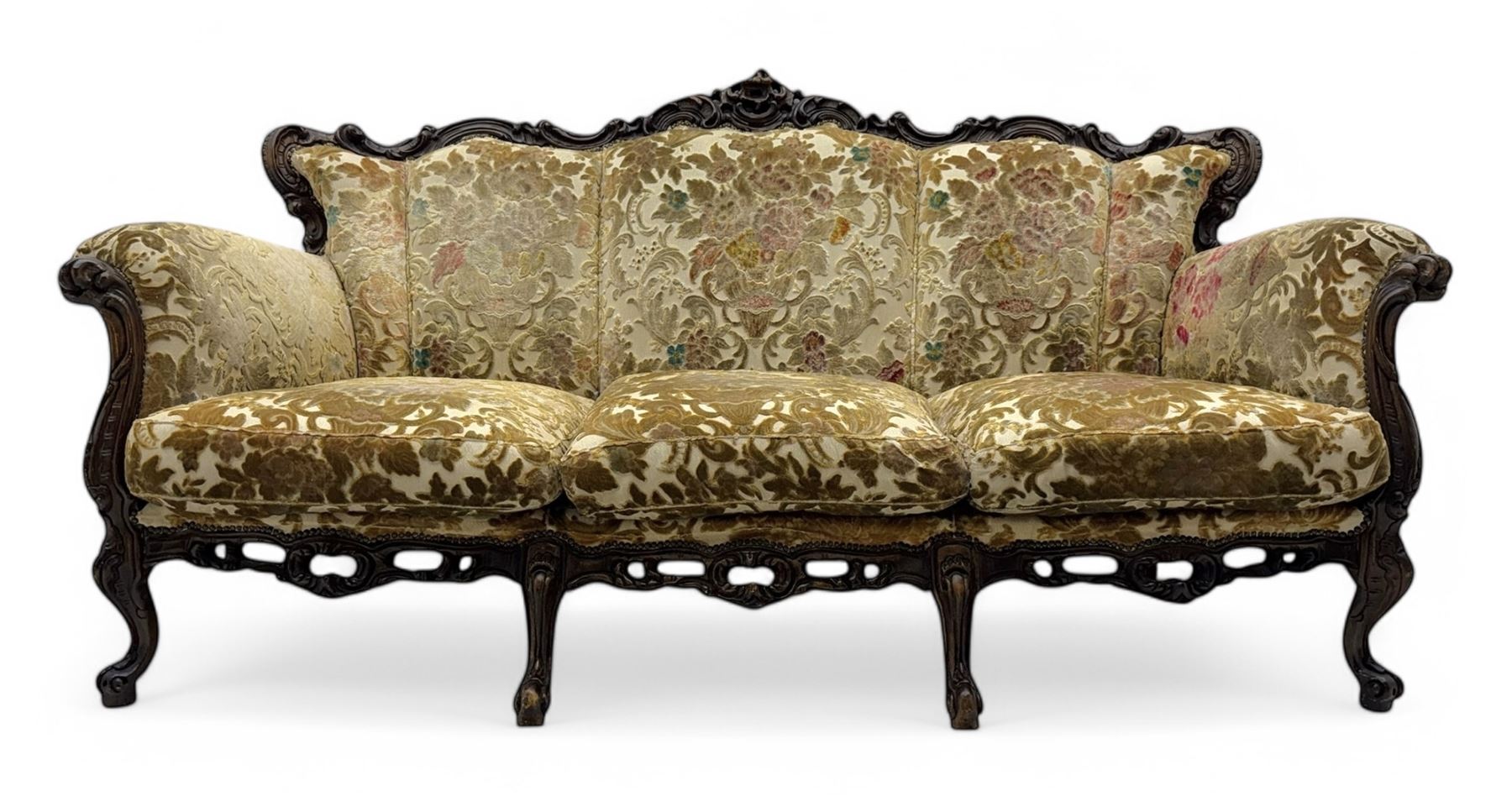Victorian design stained wood three seater settee, top rail carved and scrolled, padded back and arms, scrolled cabriole feet 