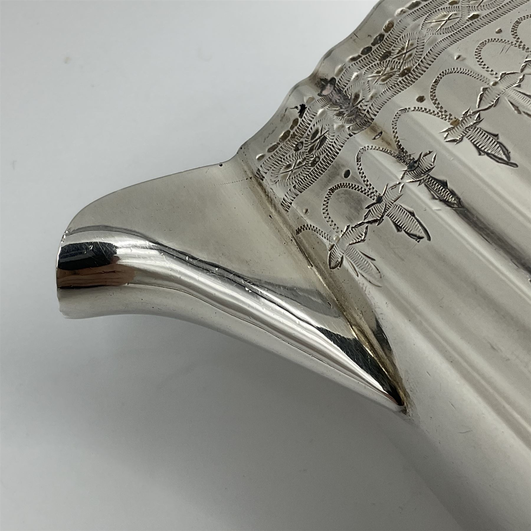 Victorian three-piece silver tea service, comprising teapot, twin handled open sucrier and milk jug, of oval form with shaped rim and C handles, each engraved with crests and bands of strapwork decoration, the milk jug and sucrier with gilt interiors, hallmarked Josiah Williams & Co, Exeter 1881, the teapot with ivory insulators and finial, all contained with a tooled leather, blue silk and velvet lined fitted case, retailed by West & Sun, Dublin 
This item has been registered for sale under Section 10 of the APHA Ivory Act