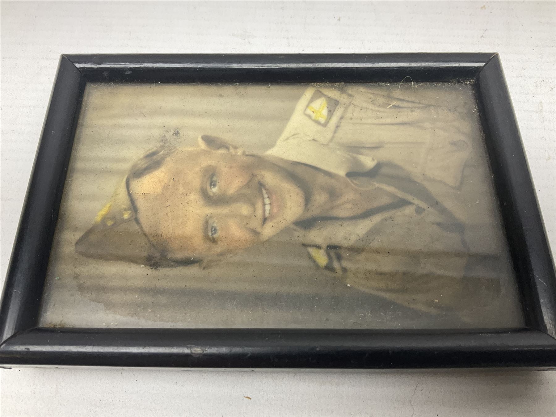 WWII group of three medals comprising 1939-45 War Medal and Italy and Africa Stars in issue box; dog tags for 282894 W. Wilkinson with framed photograph in uniform; and small quantity of cloth and metal badges including RAOC cap badge