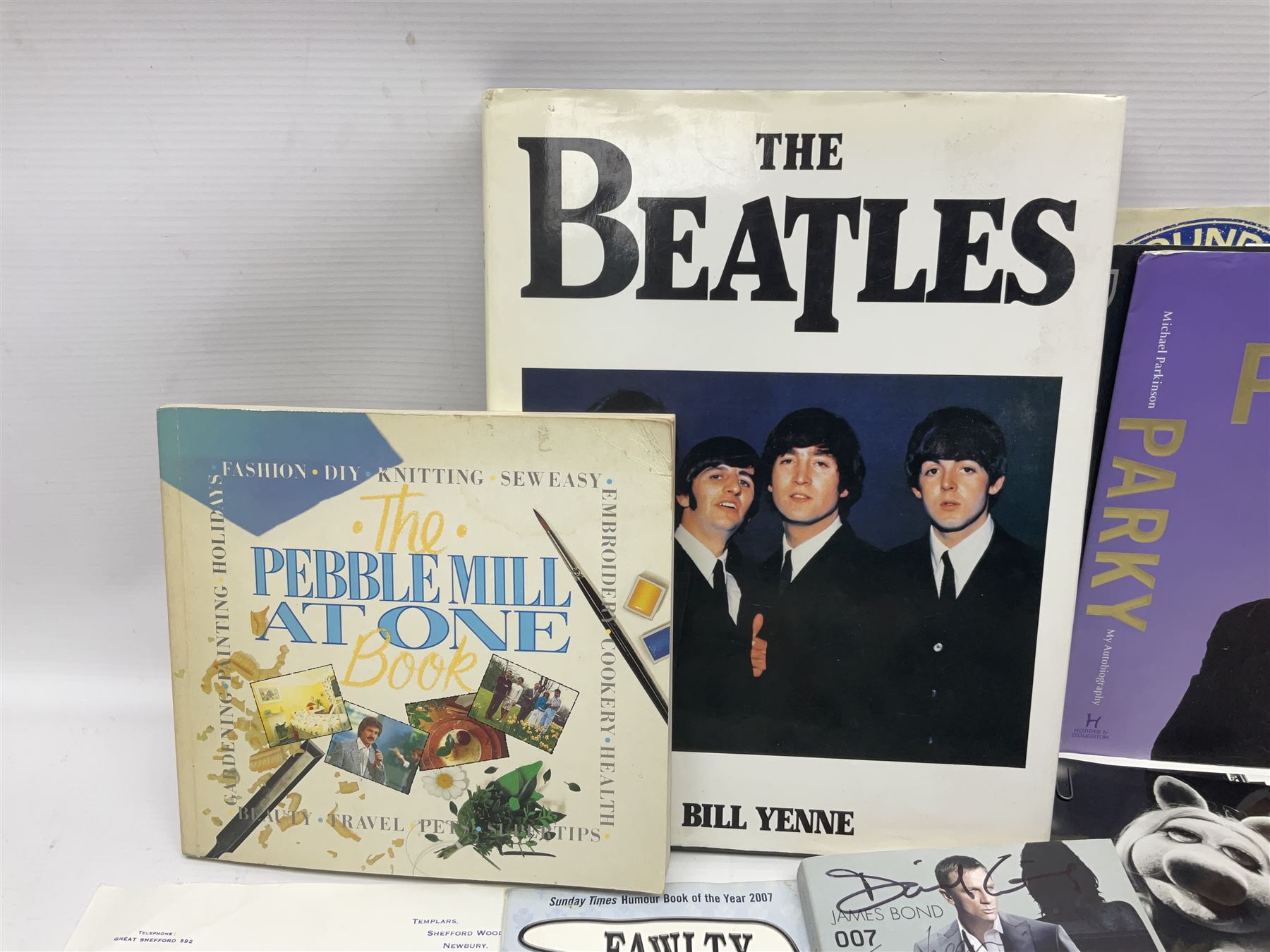 James Bond Casino Royale book signed by Daniel Craig, Judy Dench and other case members, together with Beatles book and Wing dust cover with spurious signature and other signed TV and sport memorabilia 