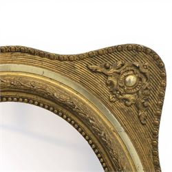 Early 20th century giltwood mirror, oval mirror plate, surrounded by egg and dart moulding, with foliate motifs