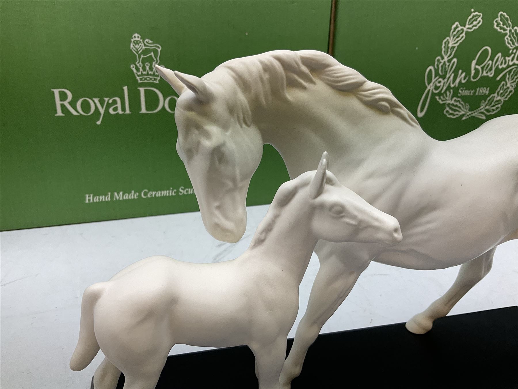 Five Beswick and Royal Doulton horse figures in matt white on black plinths, comprising of  Spirit of Affection no. 2689/2536, Springtime no.2837, Spirit of peace no.2916, Spirit of earth no.2914 and Spirit of the wild no. 183, together with a composite figure of a horse (6)