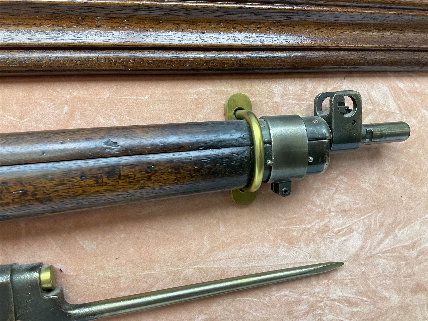 WW2 Lee Enfield No.4 Mk.1 .303 bolt-action rifle with hinged butt compartment, made by SA Ltd., Long Branch, Canada 1942, serial no.5L0646 L113cm; mounted on a framed display board with No.4 Mk.II spike bayonet, No.9 Mk.1 blade bayonet, two inert 5-round clips and brass biographical plaque by Antler Military Originals detailing DA Cert No.C3444 OLD STYLE DEACTIVATION SO FIREARMS CERTIFICATE REQUIRED OR RFD