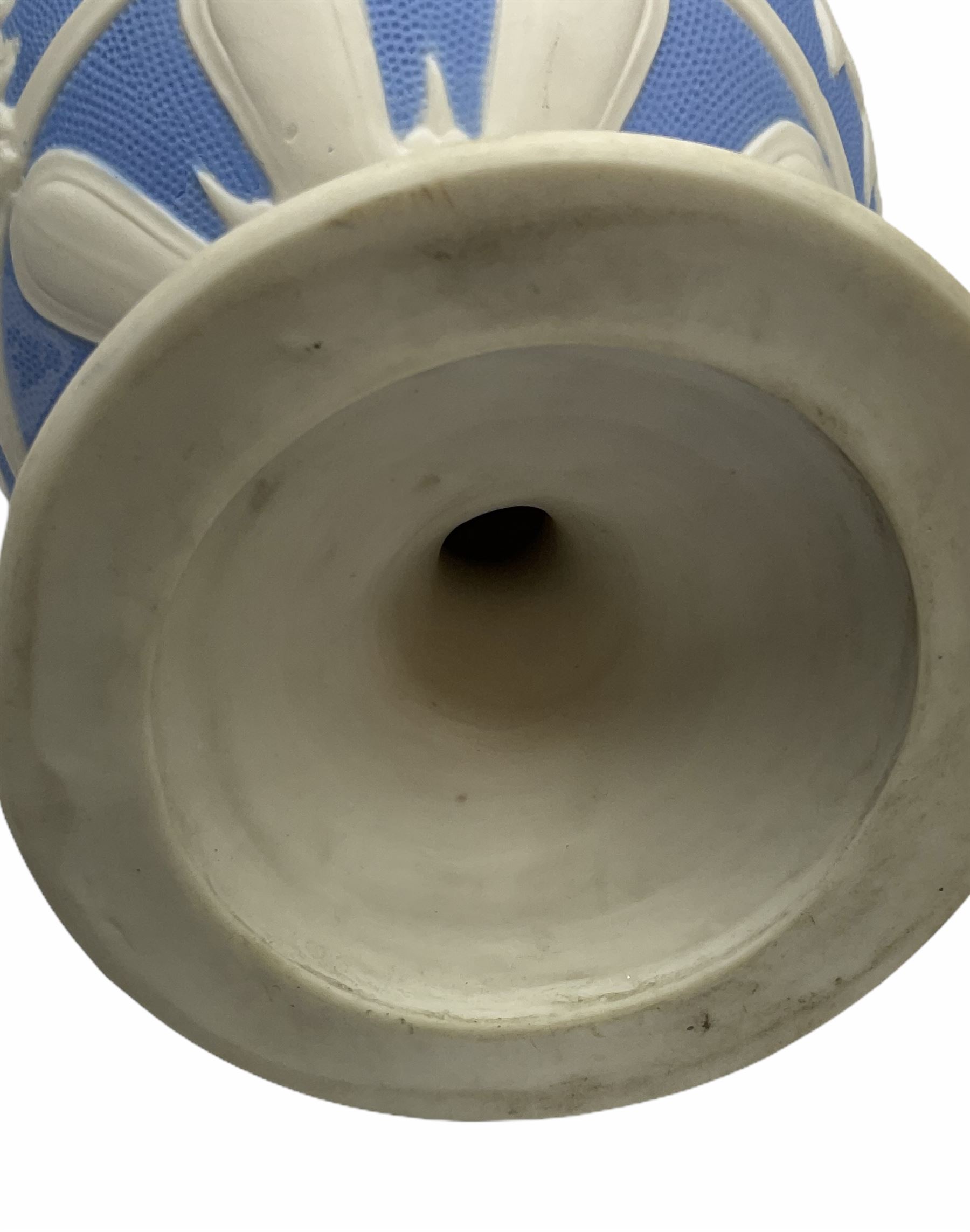 Victorian Parian ware twin handled vase detailed with Bacus masks fruiting vines and floral sprays H36cm, together with a Parian jug H14.5cm, classical Parian sculpture H40cm, decorative plaque decorated in high relief depicting two children D18.5cm. 