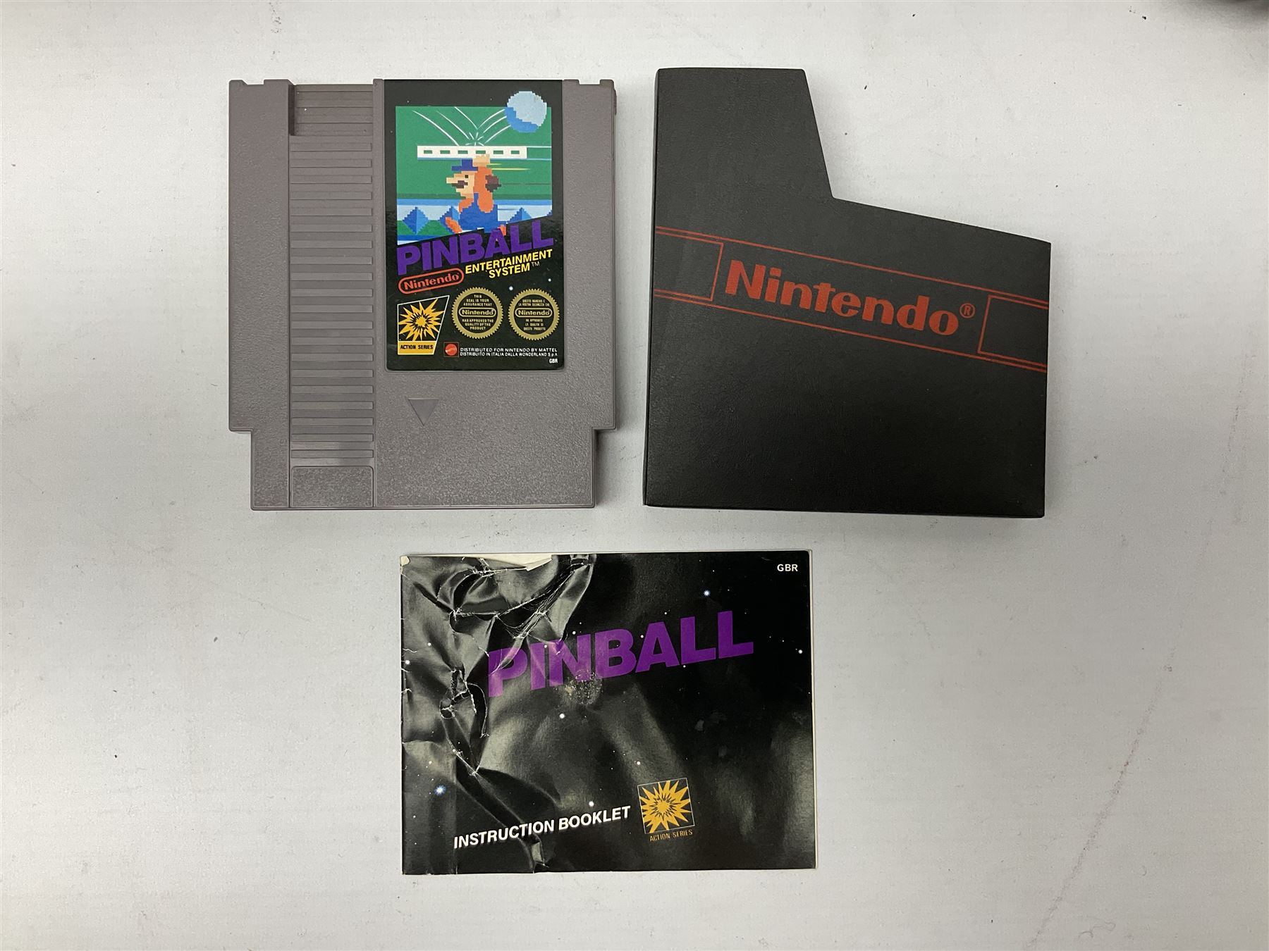 Nintendo Entertainment System (1985) console with two controllers, accessories and instruction booklet. NES Games ‘Duck Hunt’ with Nintendo Zapper gun, ‘Pinball’ and ‘Super Mario Bros.’, all with original sleeves and instruction booklets. NES game ‘Super Mario Bros. 2’ cartridge only