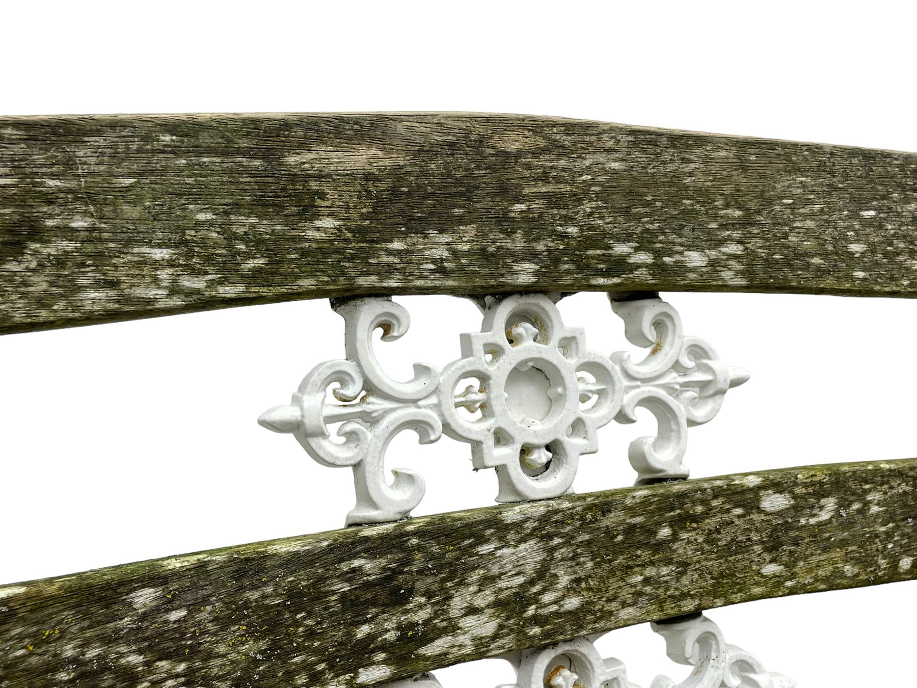 Late 19th century white painted cast iron and wood slatted garden bench, the bench ends in the form of S-scroll mythical beasts with paw feet, central cartouche surrounded by extending trailing foliage, the back slats divided by scroll cast splats, central seat support 