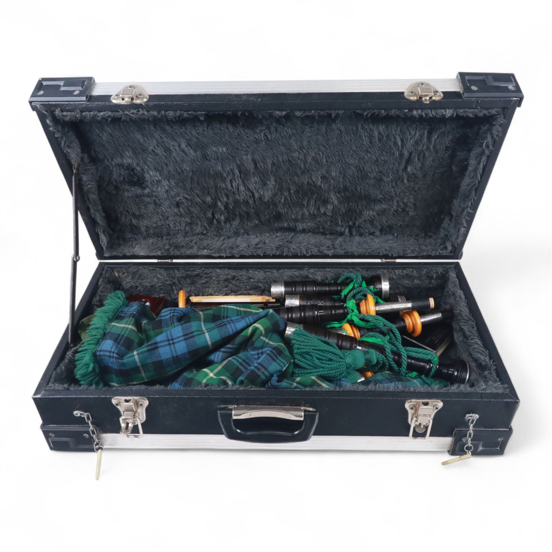 Set of late 20th century silver mounted bagpipes, the turned ebonised hardwood drone rods with Celtic knot and stipple engraved silver collars and ivorine mounts, hallmarked Bernie Leigh, Birmingham 1991, with R.G Hardie Glasgow plastic chanter and bag in green and blue Armstrong tartan, contained within a plush lined hard case, with a collection of spare reeds, drone rods, chanter, bags, cleaning accessories and other accessories 