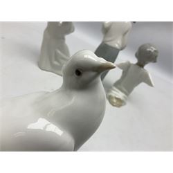 Four Lladro figures, comprising Dove no 1015, Girl with Rooster no 4677, Angel with Flute no 4540 and Angel Praying no 4538, all with original boxes, largest example H20cm