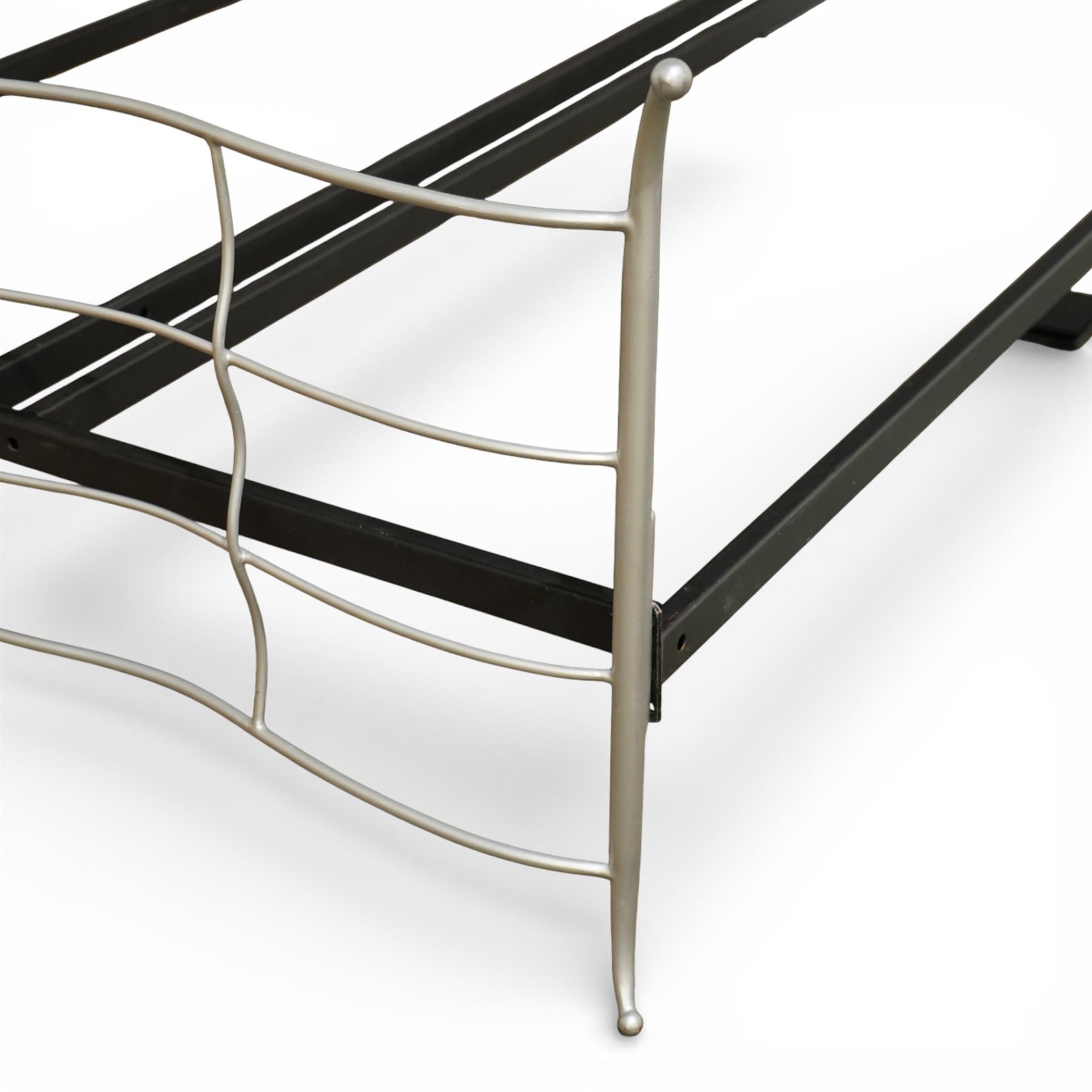 And So To Bed - ‘Verdi’ king size bed, with metal headboard and footboard formed with undulating silver painted metal horizontal bars and shaped uprights, on a black metal bed frame,