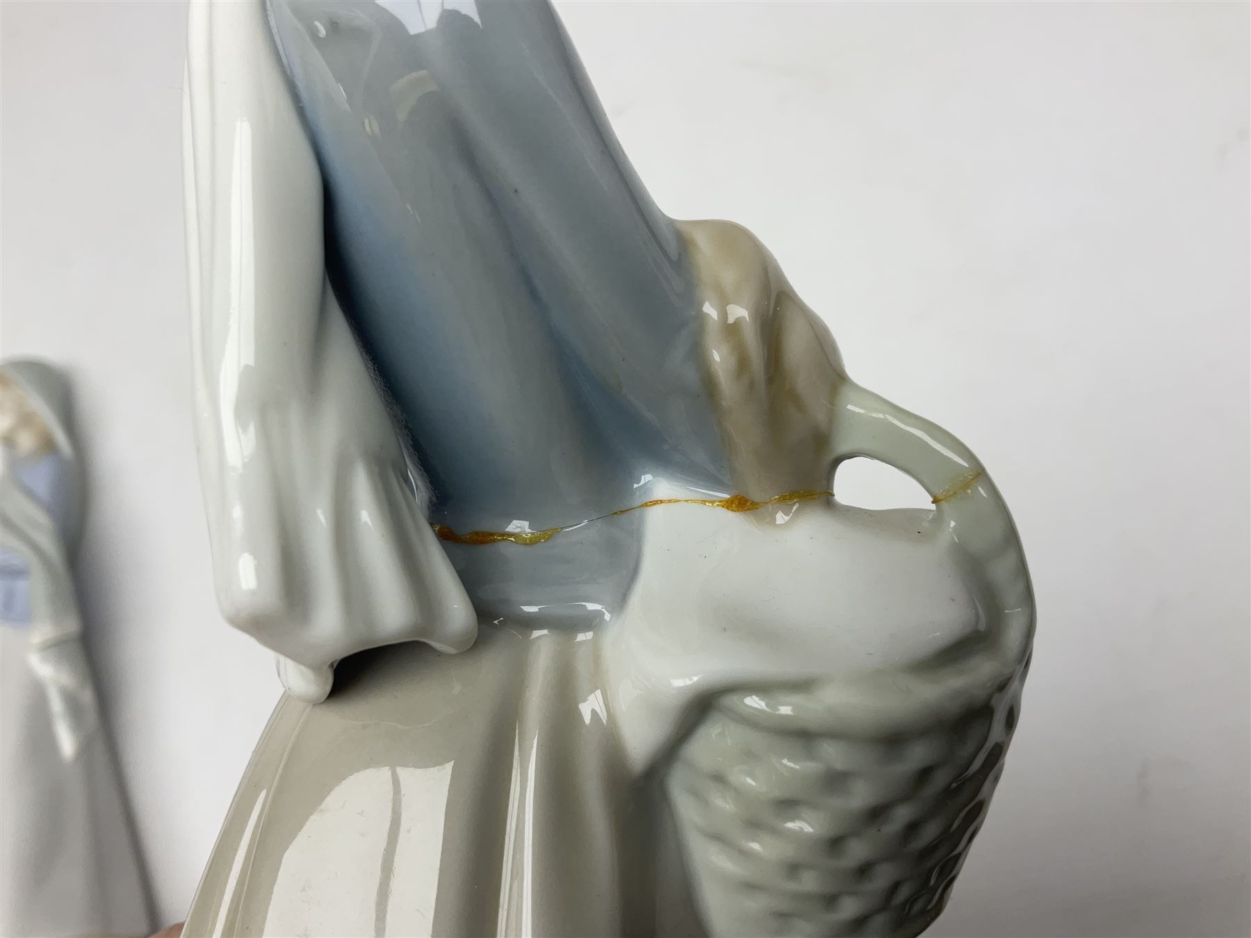 Four Lladro figures, including Girl With Cockerel no 4591, Gres Lonely no 2076 etc together with Nao figure 