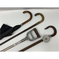 Early 20th century curved horn handle walking stick with hallmarked silver mounts, engraved L Russell 1918, together with a shooting stick by William Mills Birmingham, with leather handle, 'The Featherwaite' shooting stick and an umbrella with wooden handle