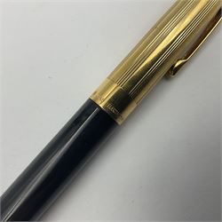 Sheaffer Crest fountain pen, the black barrel with gold plated cap and 18K nib, together with a matching ballpoint pen and further fountain pen, longest L14cm (3)