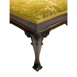 Queen Anne style mahogany square footstool, the seat upholstered in green Damask fabric with foliate design, shell carved frieze and raised on c-scroll carved cabriole supports terminating at pointed feet