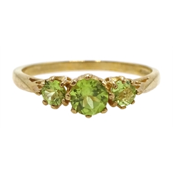 Gold peridot pendant necklace and gold three stone peridot ring, both 9ct hallmarked or stamped 