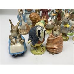 Sixteen Royal Albert Beatrix Potter figures, including Poorly Peter Rabbit, Jemima Puddle Duck and Squirrel Nutkin etc, all boxed together with a Beswick Beatrix Potter Jeremy Fisher miniature jug and four Beswick Wind in the Willows figures 