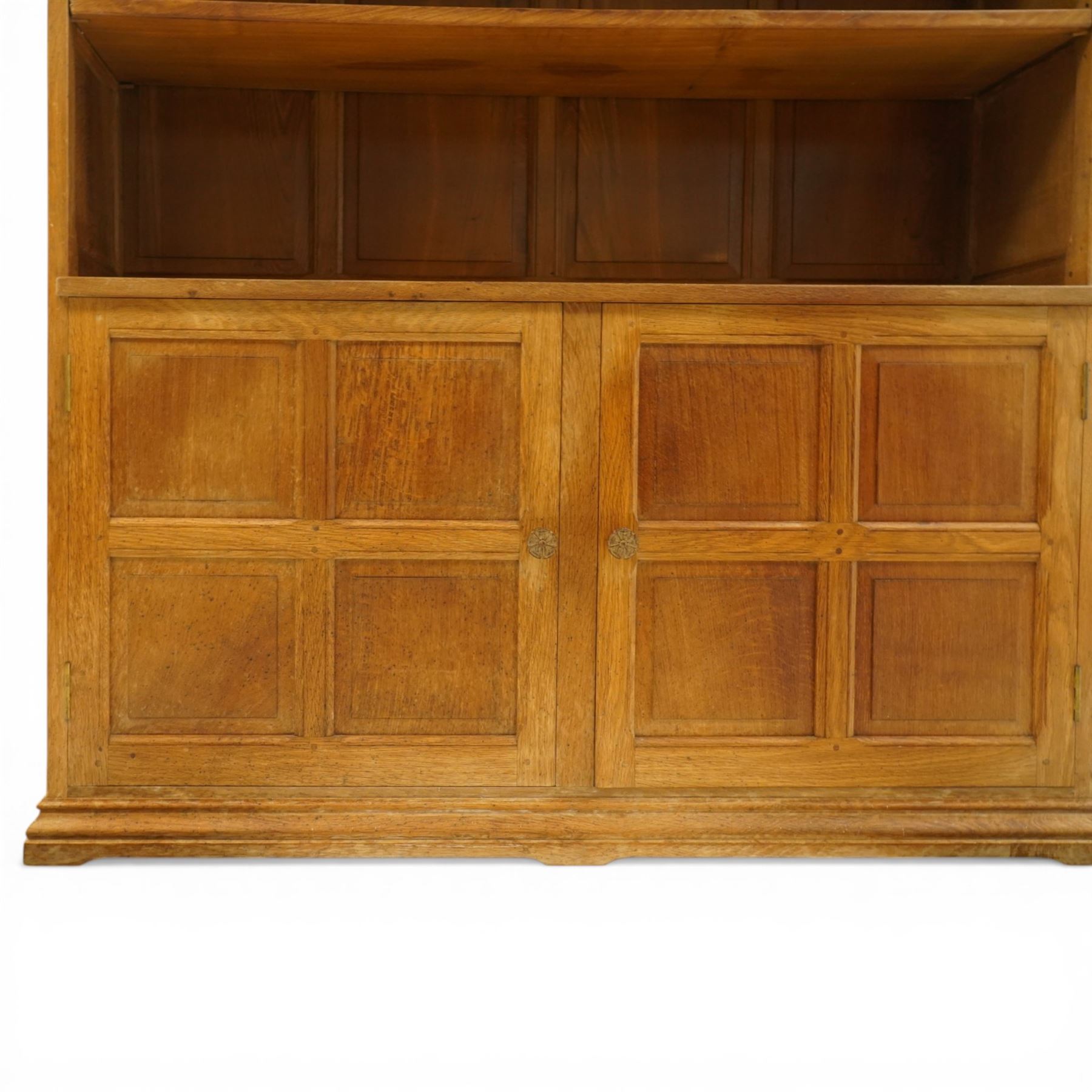 Beaverman - Yorkshire oak open bookcase, with adjustable shelves, panelled sides and lower cupboard doors, with carved beaver signature, by Colin Almack of Sutton near Thirsk