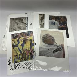 Collection of approximately 200 Leeds United related autographs, predominantly signed newspaper cuttings, contained within ring binder, together with a number of loose examples