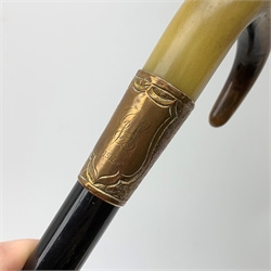 A silver mounted walking cane, hallmarked Thomas Davis, London 1913, together with a horn handled and ebonised example with copper mount, H90.5cm. 