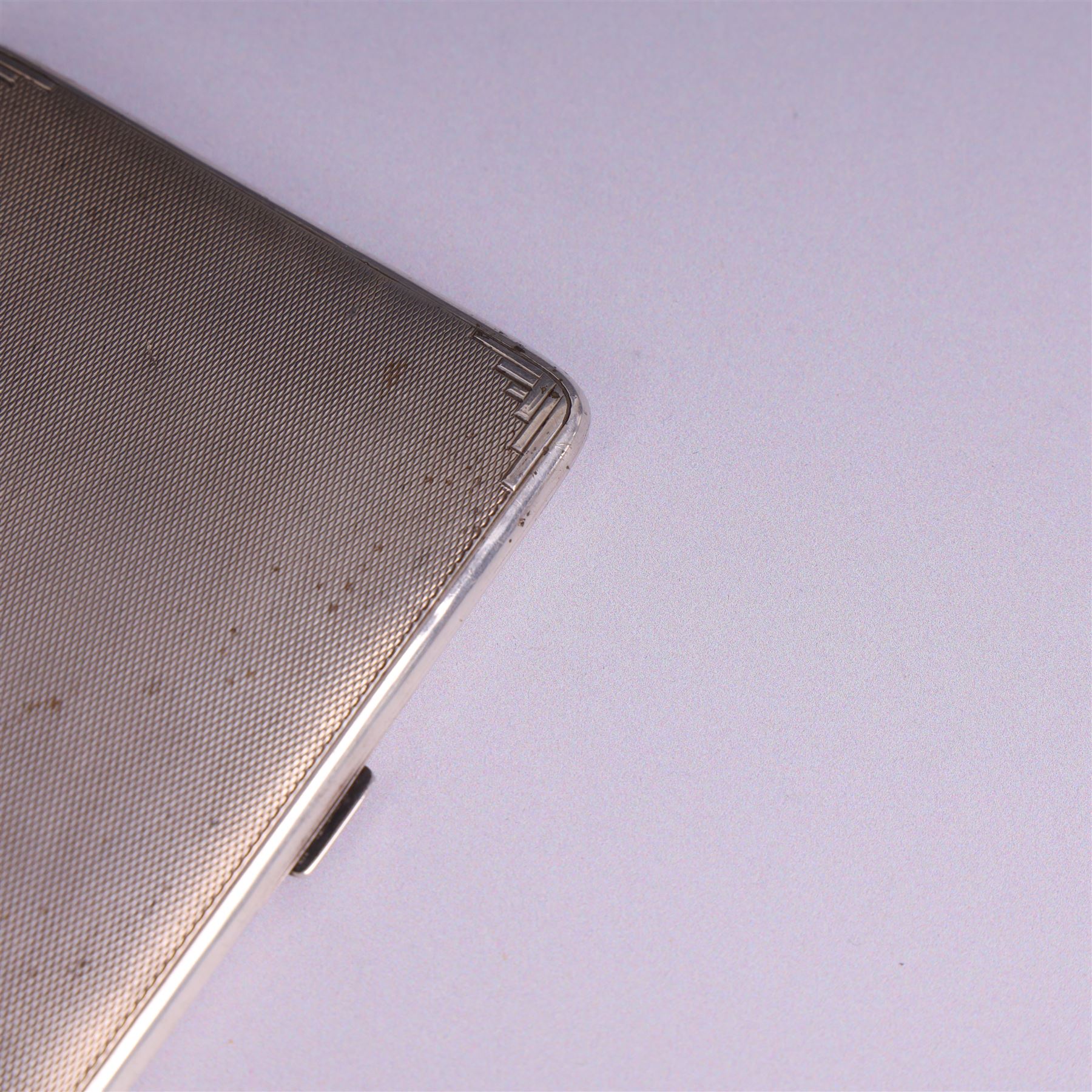 1930s silver cigarette case, of rectangular form with rounded corners, with engine turned decoration throughout, with personal engraving to interior, hallmarked Padgett & Braham Ltd, London 1931, L 11cm 