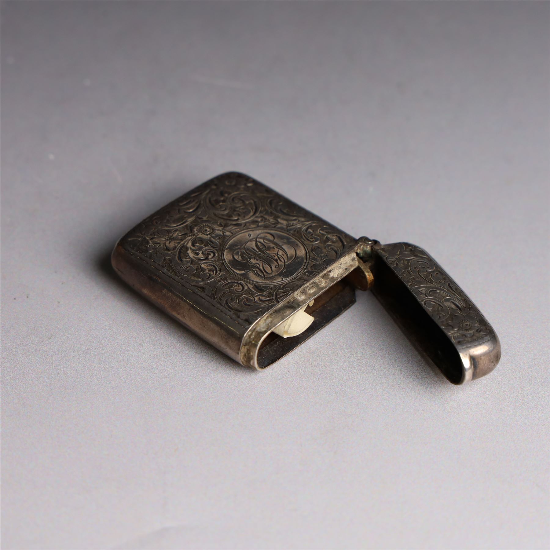 1920s silver cigarette case, with engraved initials and foliate decoration to cover and personal engraving to interior, hallmarked Smith & Bartlam, Birmingham 1924, with a similar silver vesta case, hallmarked, cigarette case H8.5cm