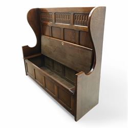 18th century design oak hall bench or settle, tall panelled back decorated with carved arcade, on two shaped end supports, hinged box seat opening to reveal a storage compartment, on a panelled base