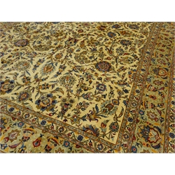  Persian Kashan rug carpet, ivory ground decorated with interlacing scrolled foliage and stylised flower heads, seven band border with repeating pattern, 402cm x 282cm  