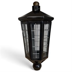 Georgian design black-painted metal octagonal hanging lantern, with brass ball finial abov...