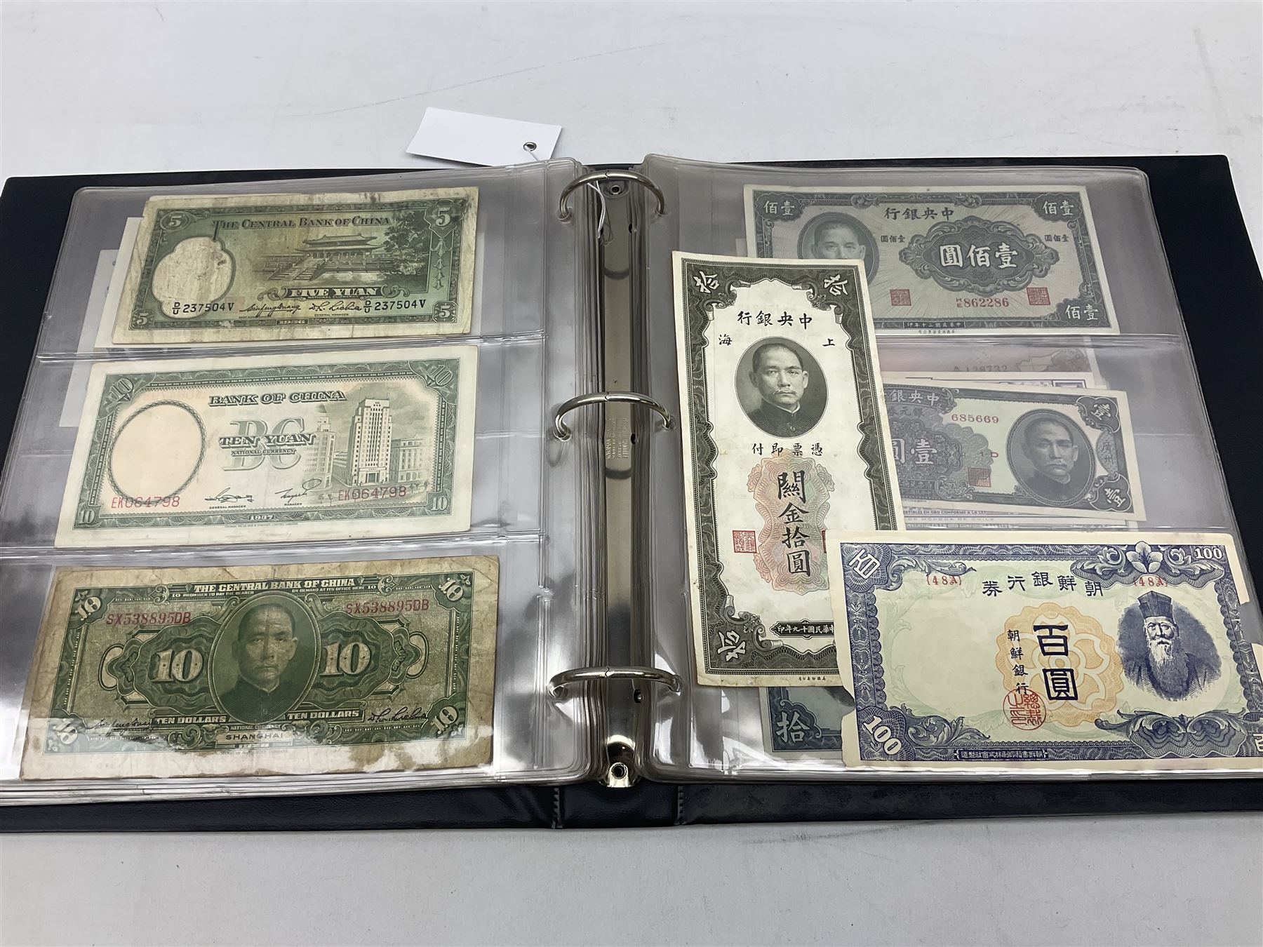 World banknotes, including Queen Elizabeth II The States of Jersey one pound 'DB202703', five pounds 'BB527762' and ten pounds 'AB651481', reserve bank of New Zealand two dollars '1L3 741894', King George V Straits Settlements one dollar 1st January 1935 'F/83 28924', various Bank of England notes etc, housed in two ring binder albums