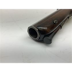 Early 19th century flintlock 16-bore overcoat/duelling pistol by William Bond Lombard Street London, the 23cm octagonal brown stub twist damascus barrel with small foresight, two barrel pins and ram rod under, inscribed Lombard Street London to the top and W. Bond to the action, full walnut stock with lightly engraved steel furniture, pineapple finial and escutcheon, half cock facility L39cm; loose mounted on later mahogany display stand with trade label