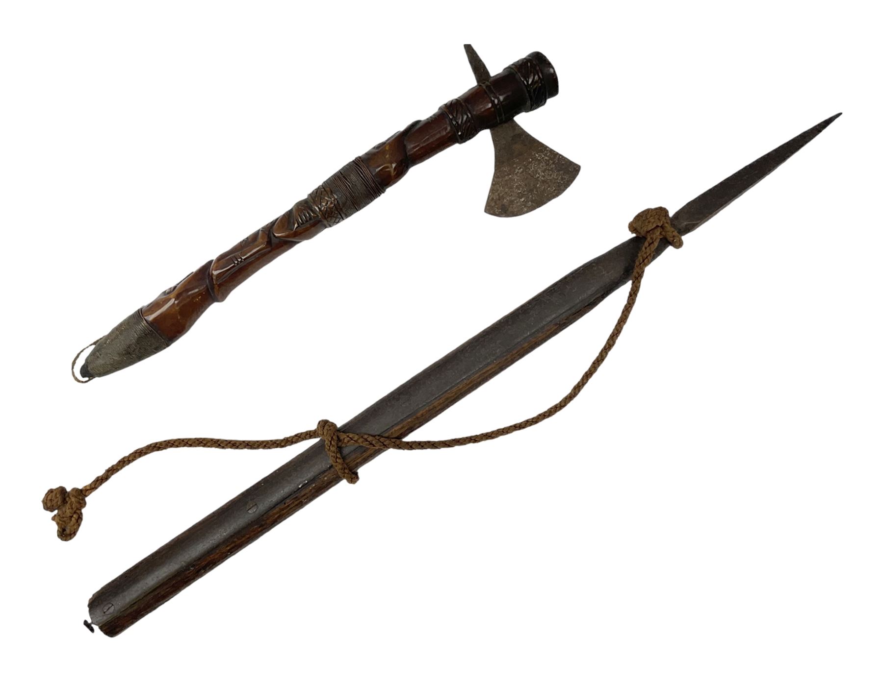 Tribal Art - an African axe, possibly Yoruba, the bone shaft carved as two cord bound stylised figures with iron fan-shaped blade, L35cm overall; and 19th century harpoon or spear head of square section with two long fixing arms on cut-down ash shaft L57cm (2)