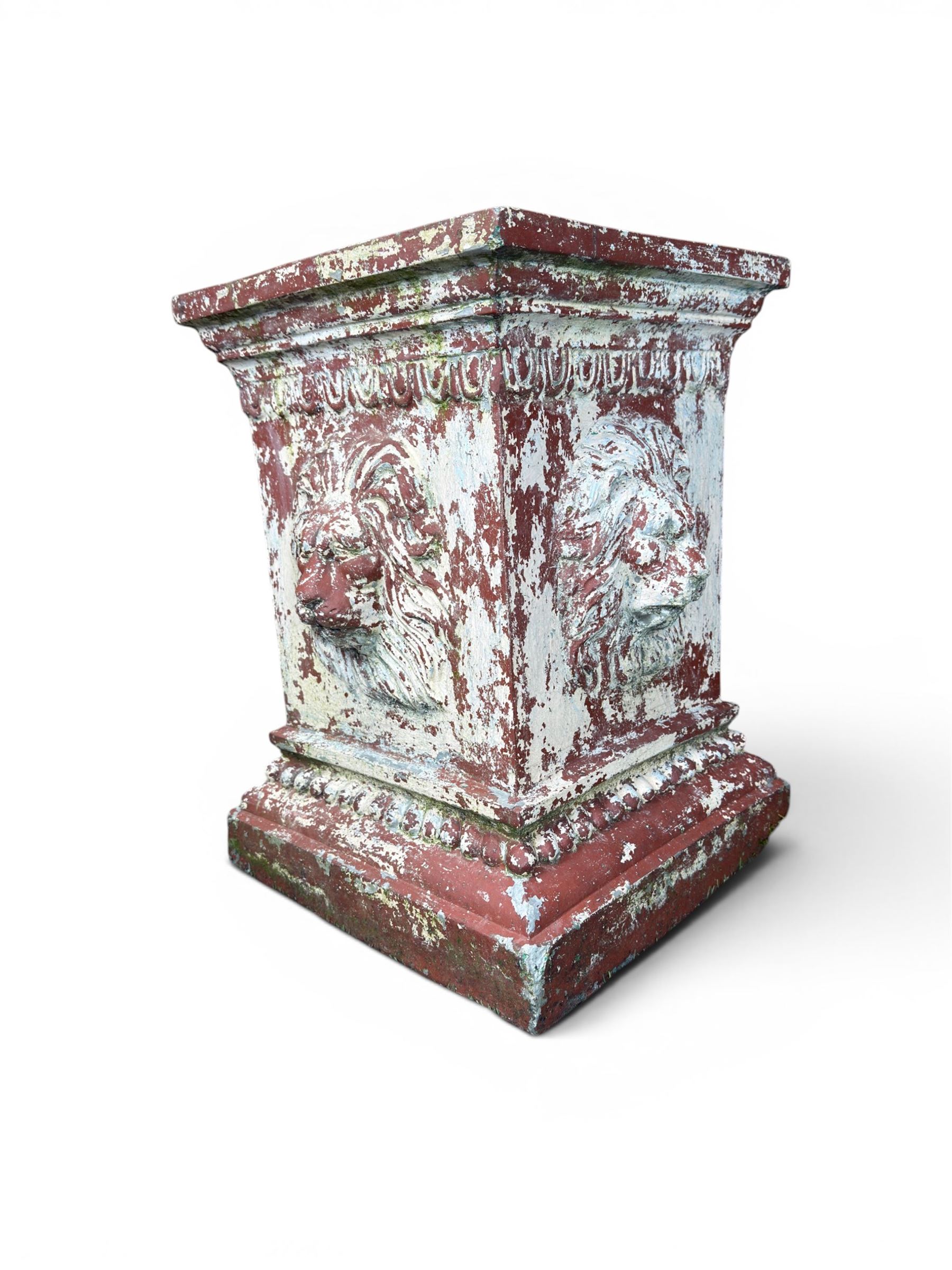 Early 20th century terracotta pedestal, square form with egg and dart detail, four lions masks to either side, finished in distressed cream paint