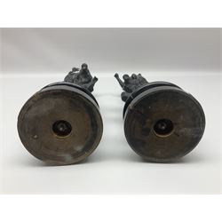 Pair of spelter figures, Le Force and Le Pouvoir, modeled as figures standing on lions, arms held aloft, H51cm 