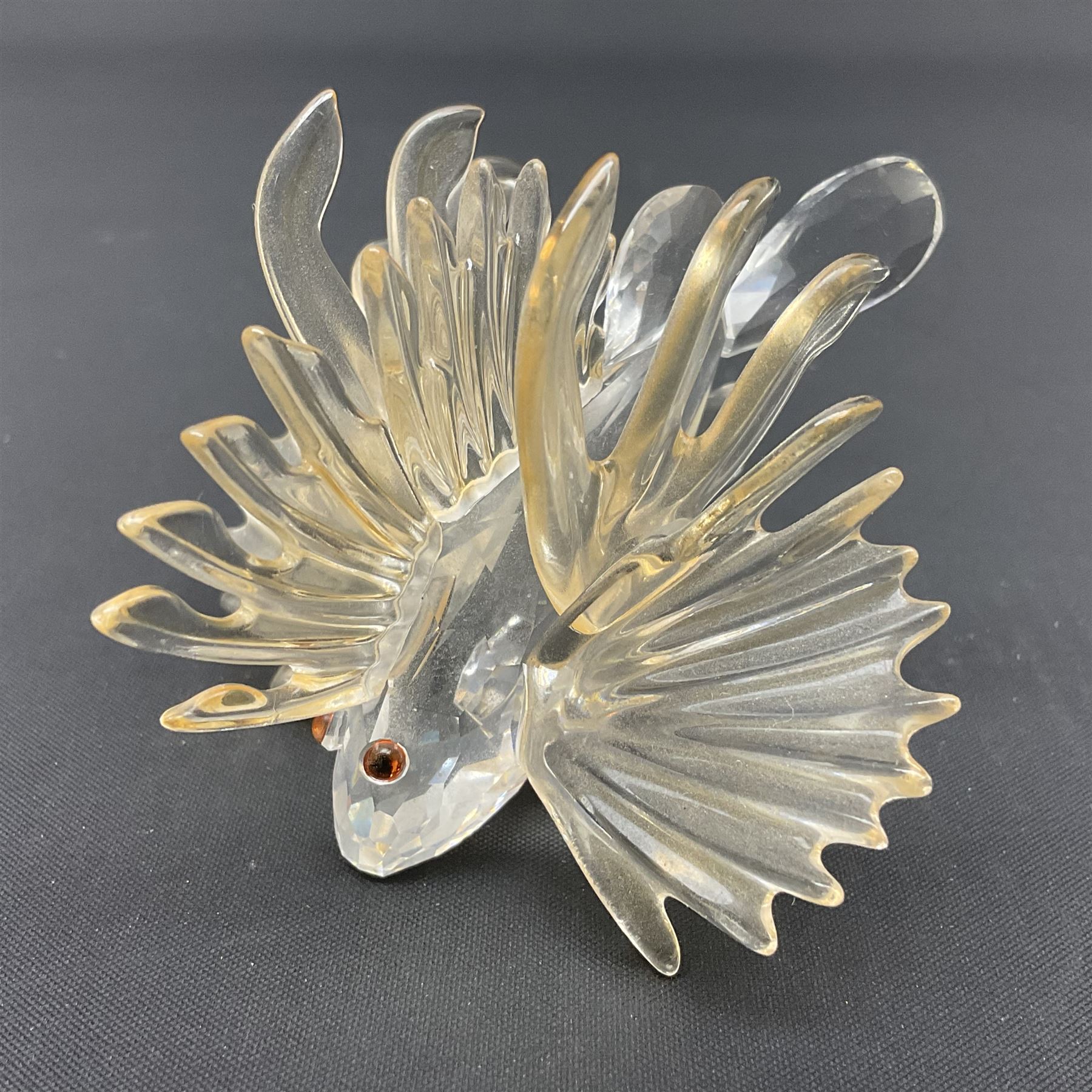 Swarovski Crystal sea creatures, comprising lion fish and dolphin, both with coloured elements, together with two seahorses, two small fish groups, butterfly fish, longnose butterfly fish and six coloured shells, tallest H8.5cm